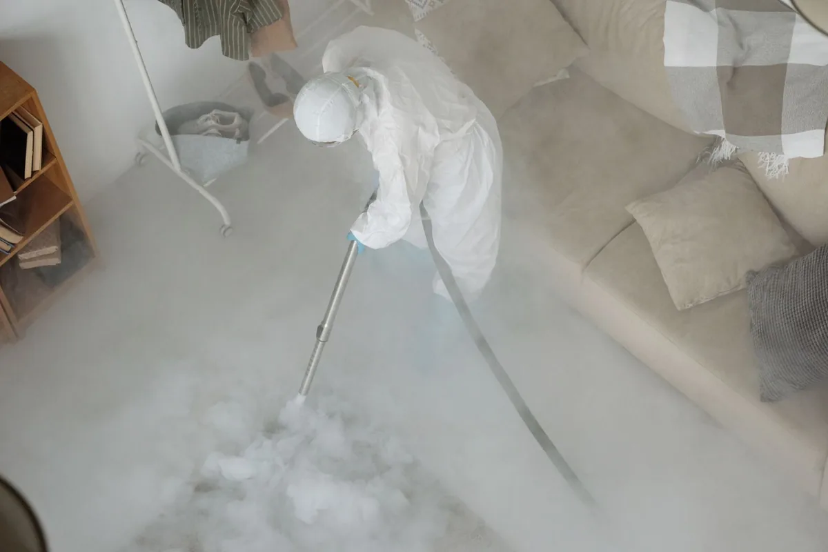 Biohazard cleanup technician in protective equipment, Davison, Detroit, MI